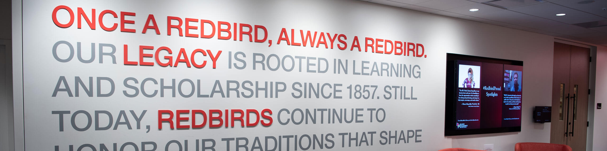 Wall in the Bone Student Center that reads 'Once a Redbird, Always a Redbird'.