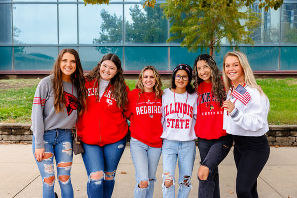 A group of students wearing ISU merchandise.