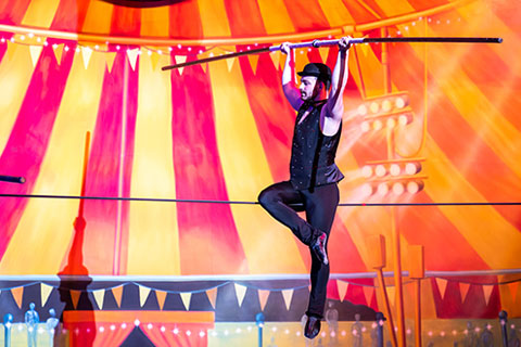 A performer walks the tight-rope during Gamma Phi Circus.